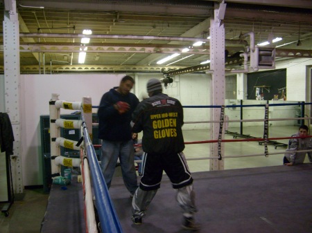 Hilario, working the pads with trainer Jacques Davis the week before the fight, is impressively determined. But his lack of defense endangers him. © Copyright Mark Connor, 2009 (Uppercut Boxing Gym www.uppercutgym.com, is where Hilario trains.)